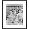 Four Young Woman Waterskiing in the Sea