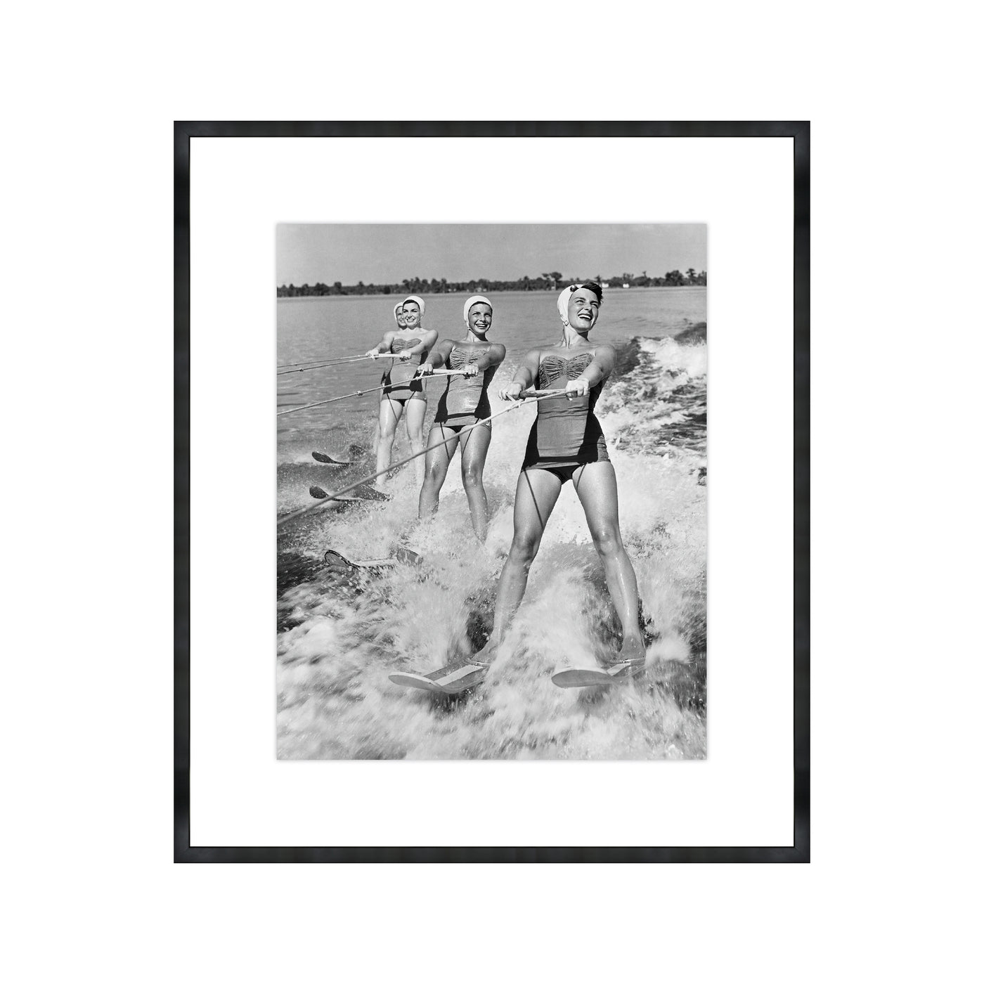 Four Young Woman Waterskiing in the Sea
