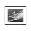 Framed black and white photograph of two people water skiing.
