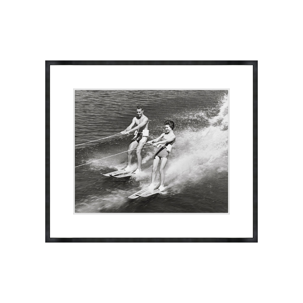 Young Couple Water Skiing