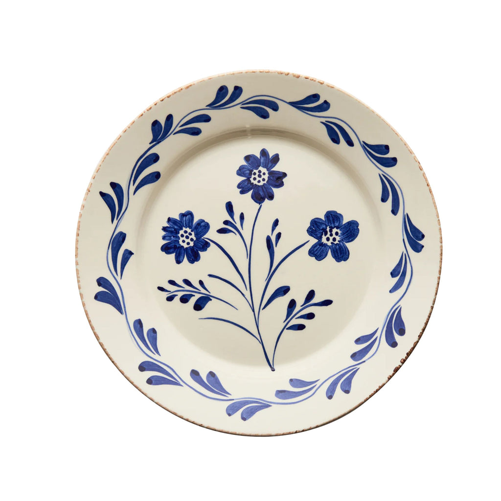 Hand painted ceramic dinner plate with blue floral motif and vine border