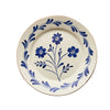 Hand painted ceramic dinner plate with blue floral motif and vine border