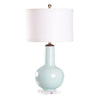 Light blue ceramic vase with white lampshade on a white background