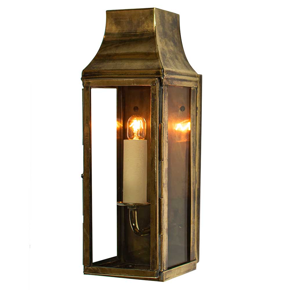 Strathmore Slim brass wall lantern in aged brass finish with narrow profile and candelabra bulbs